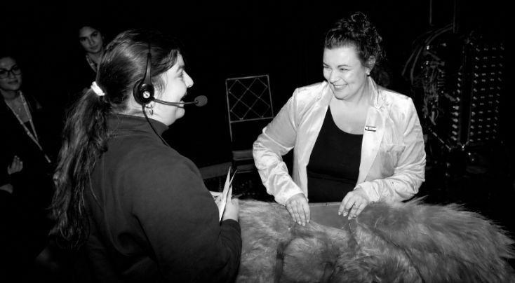 Krissy King backstage with a crew member at a Bureau Fashion Week production
