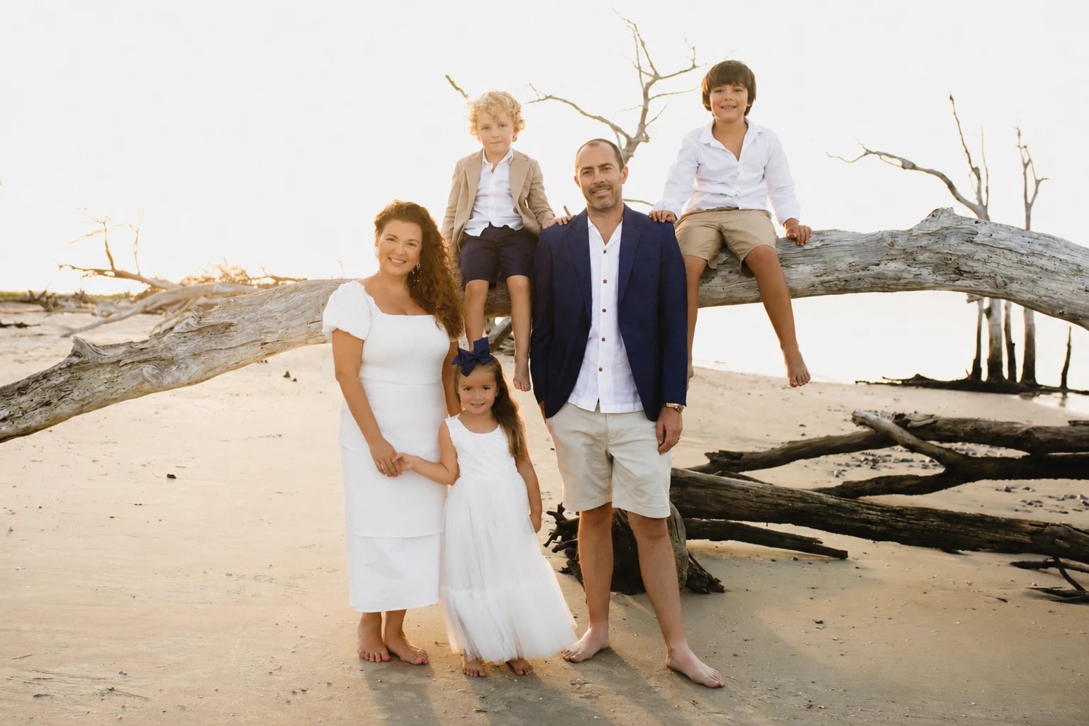Brady and Krissy King with their three children on the beach